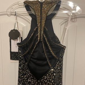 Never Worn black and gold prom dress. Size 4.